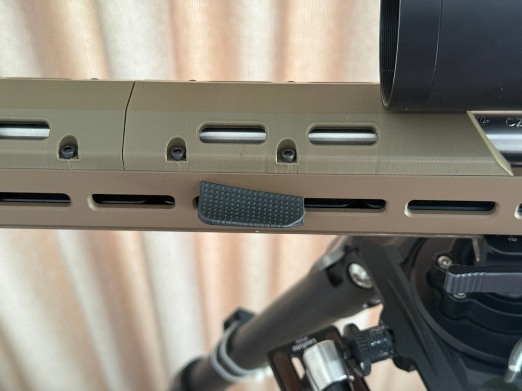 M-Lok forward thumb rest.