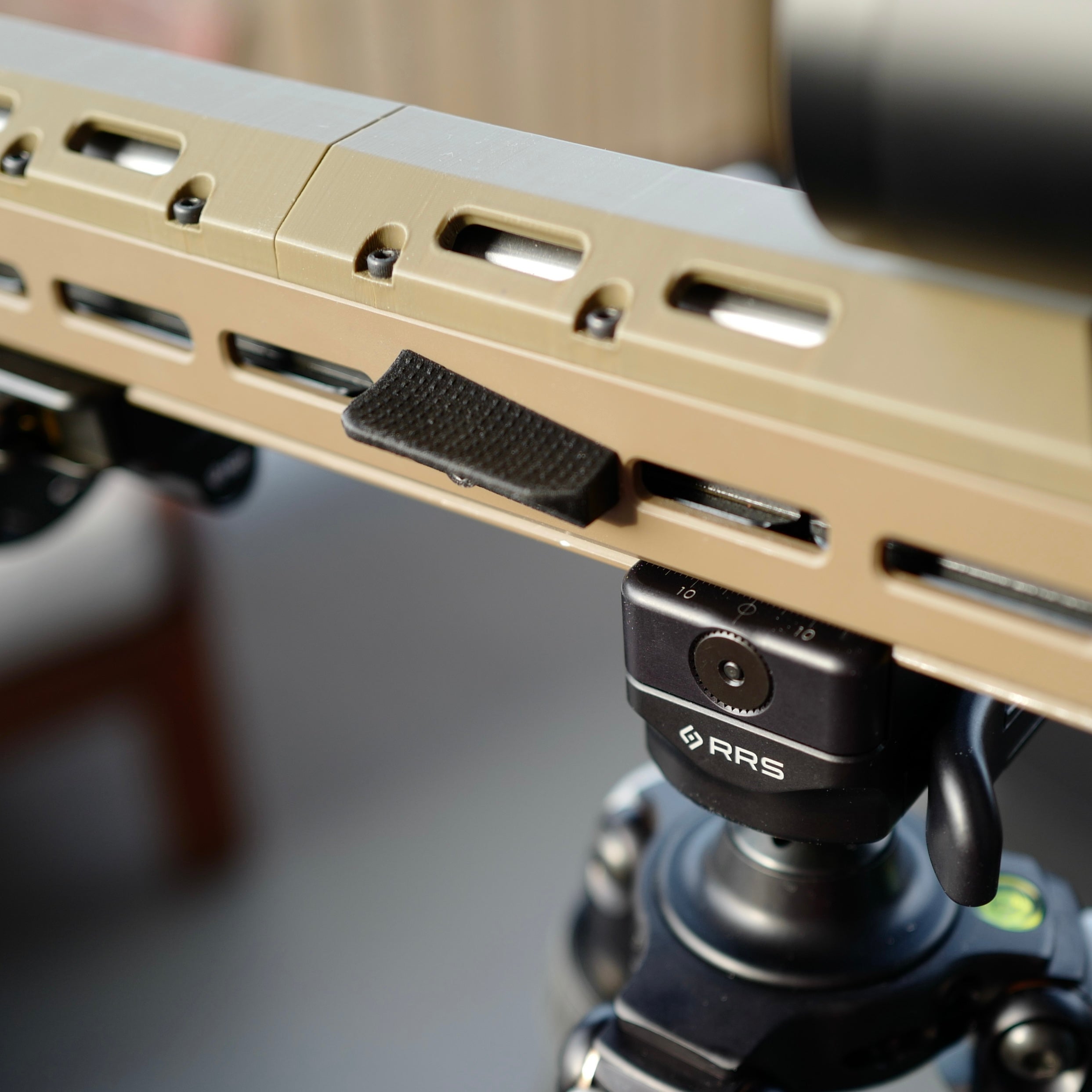 M-Lok forward thumb rest.