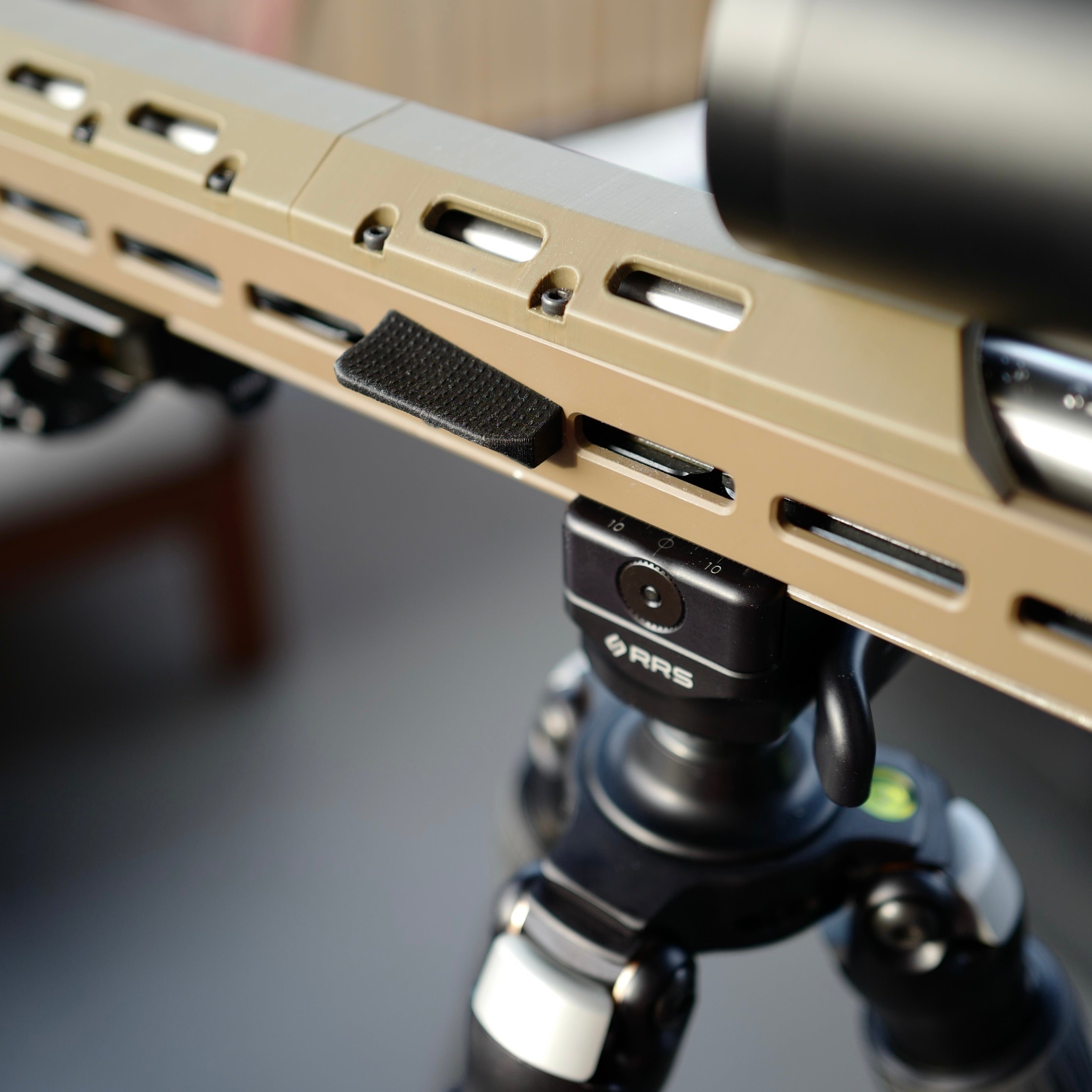 M-Lok forward thumb rest.